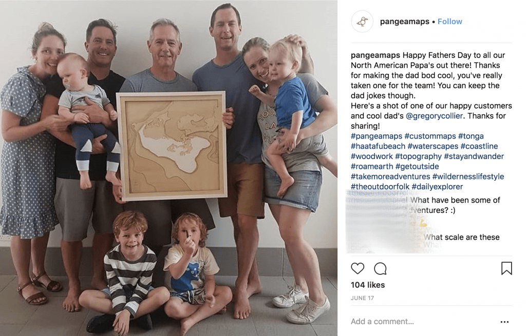 Family Celebrating Fathers Day with A Pangea Map